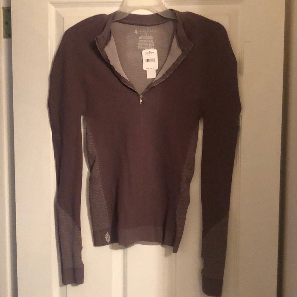 Long sleeves.  Free people movement shirt with tags. Mocha night color size L.